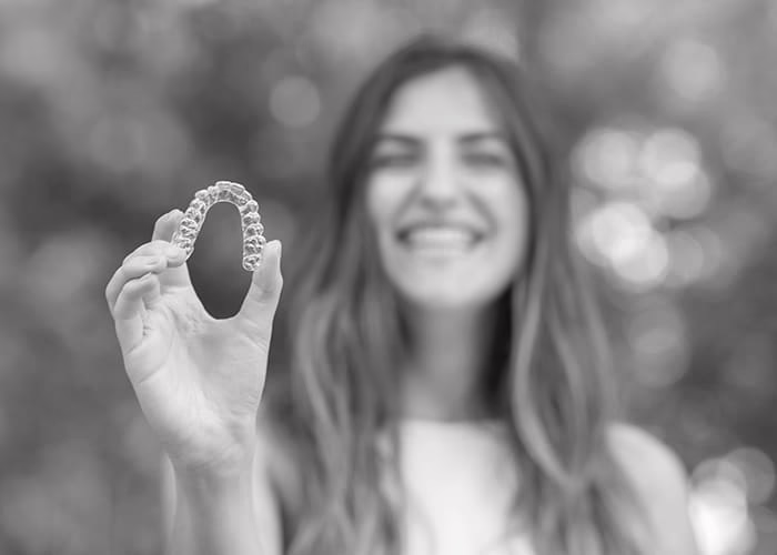 Teen showing off their Invisalign aligner in Encinitas California