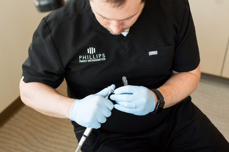 Orthodontist giving retainer instructions to patient in encinitas california