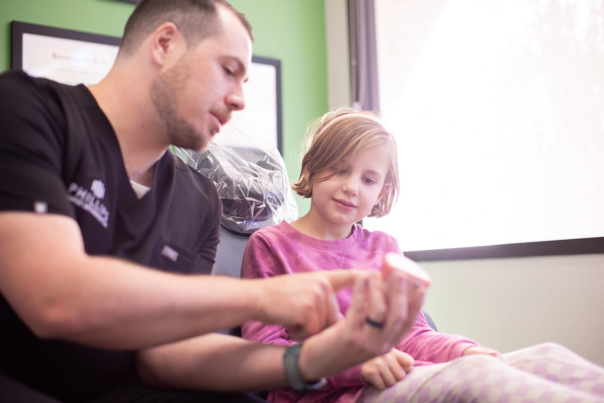 Dr. Joseph Phillips smiles while in clinic.